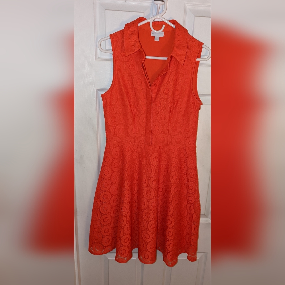 New York company..orangish/reddish color lace material.. front buttons